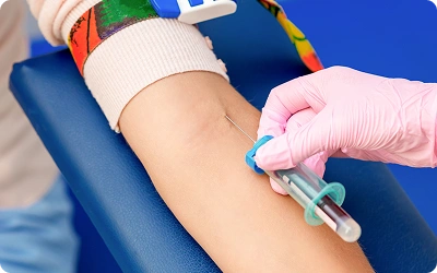 Blood sample collection from child at pediatric oncology care