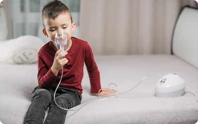 Child receiving pediatric pulmonology treatment