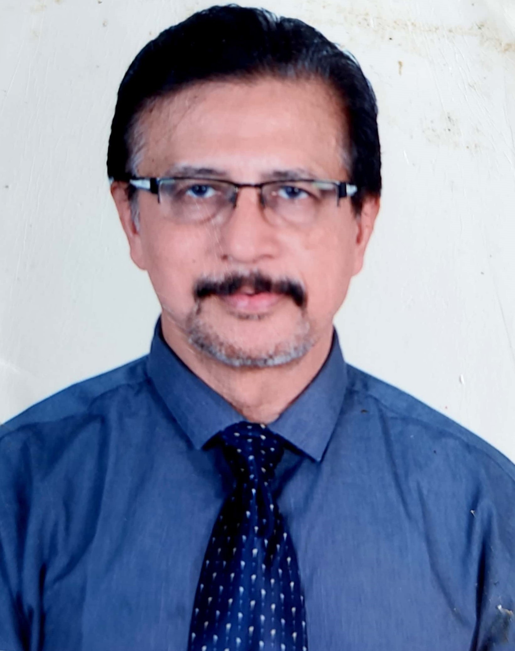 Portrait of Dr. Riaz Ahmed, Senior Consultant in Pediatric Neurology.